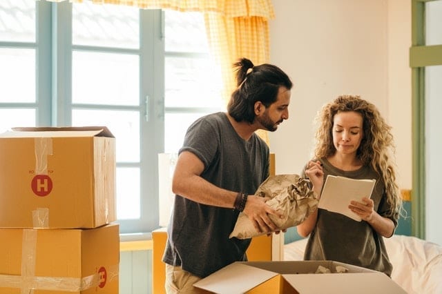 a professional organizer is correcting their client’s moving plan