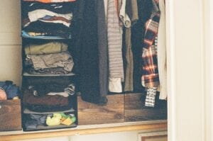 A wardrobe full of clothes.