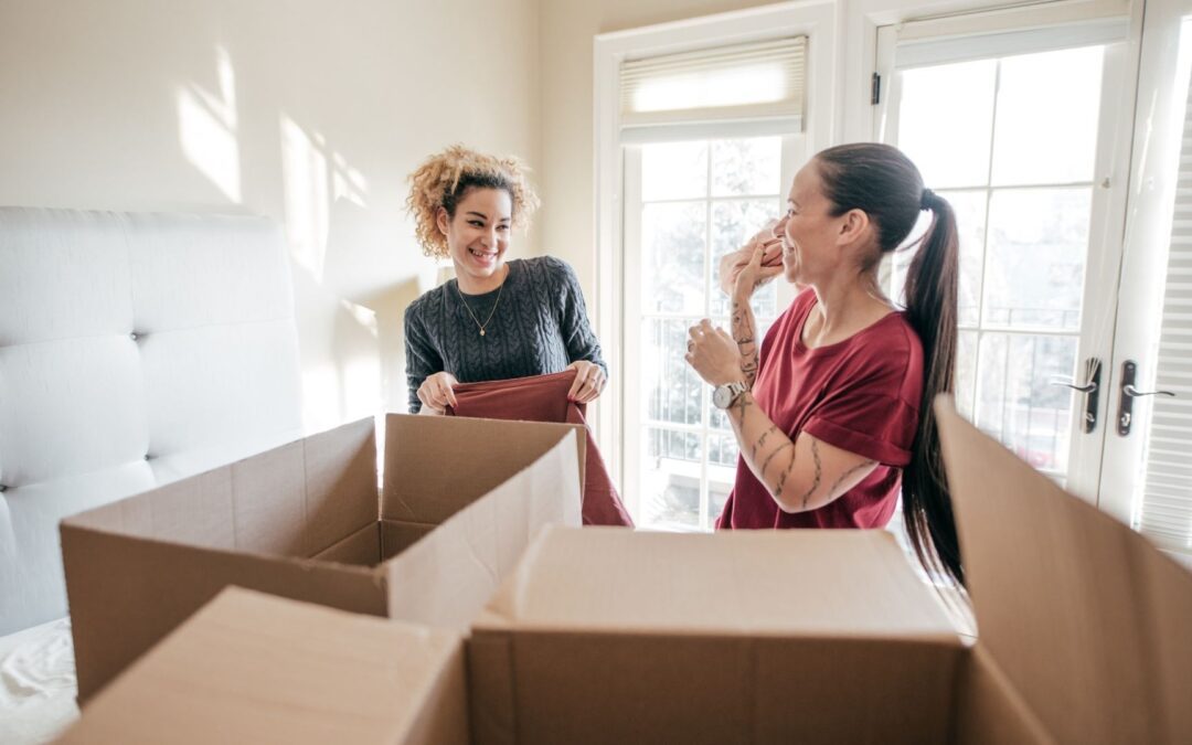2 women using moving organization tips