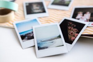A pile of different polaroid photographs
