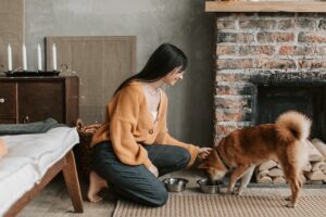 Woman feeding her dog