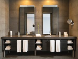 A double sink vanity in a modern and hotel-like bathroom.