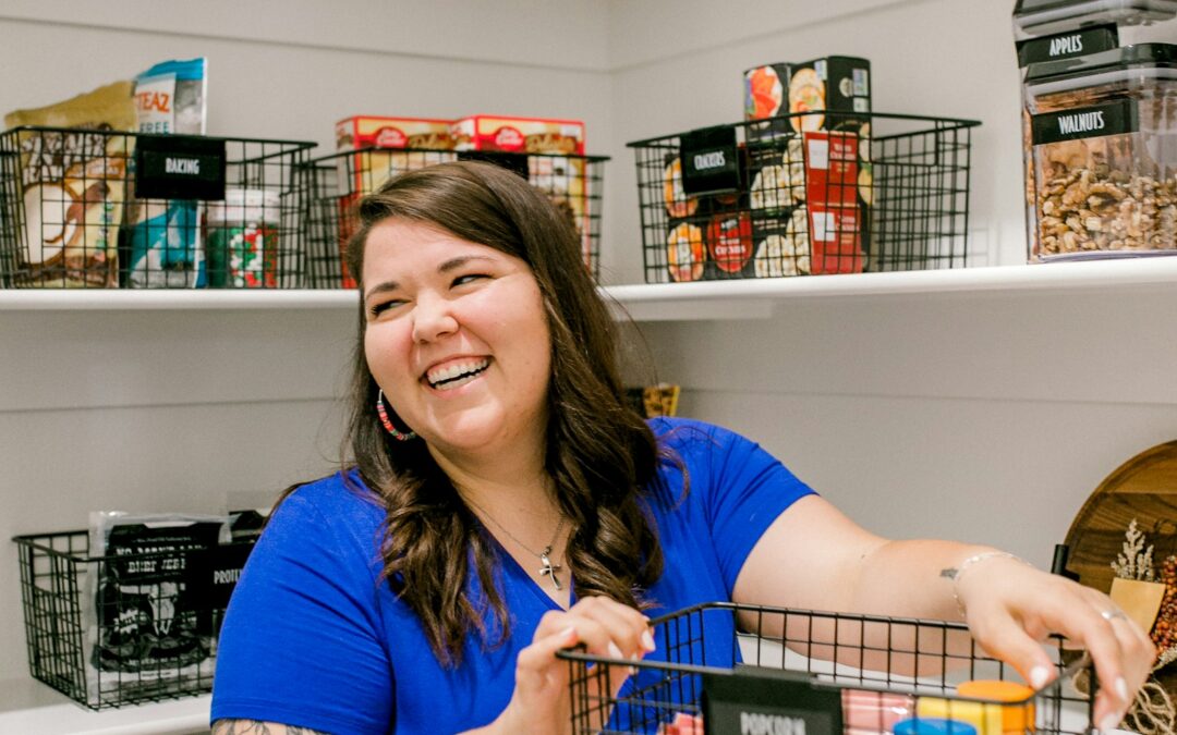 Professional organizer arranging a labeled pantry