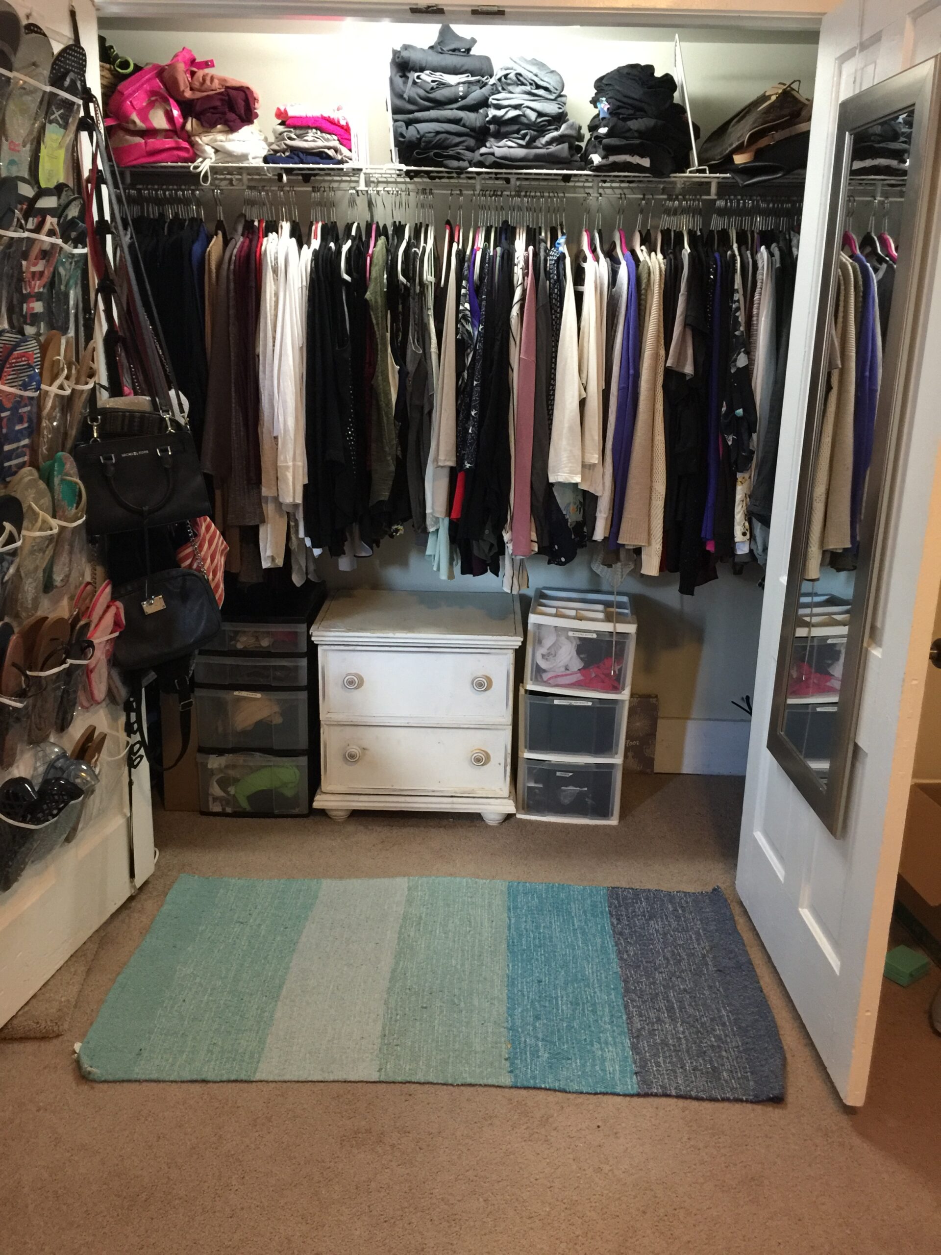 Organized bedroom closet after a WOW Organizing project