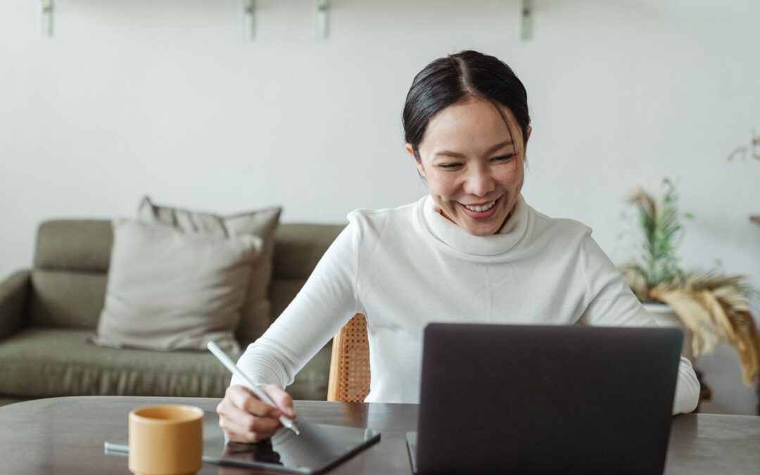 Woman using a laptop for a virtual organizing session